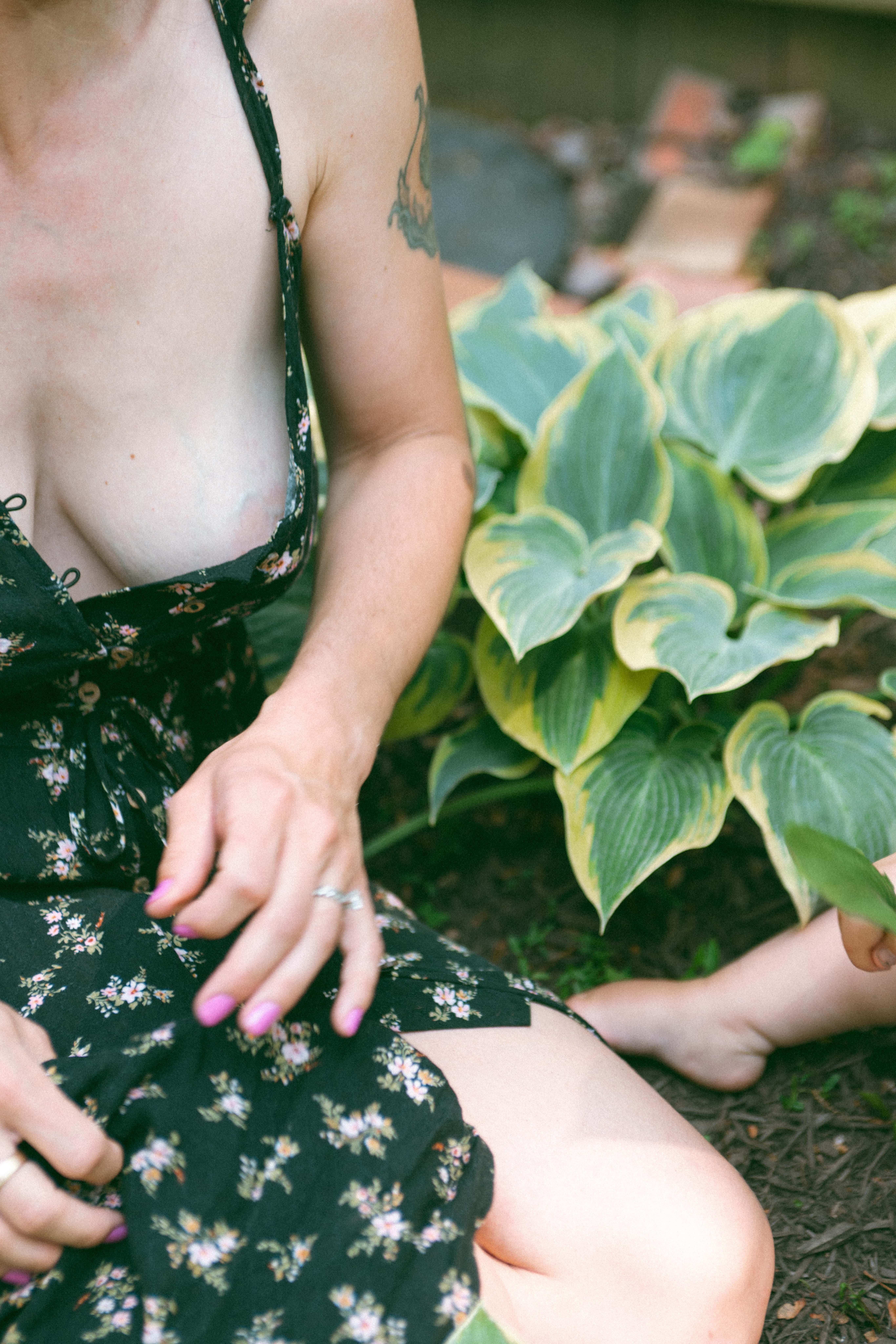 close up of mothers dress while sitting in the garden during the motherhood photoshoot 