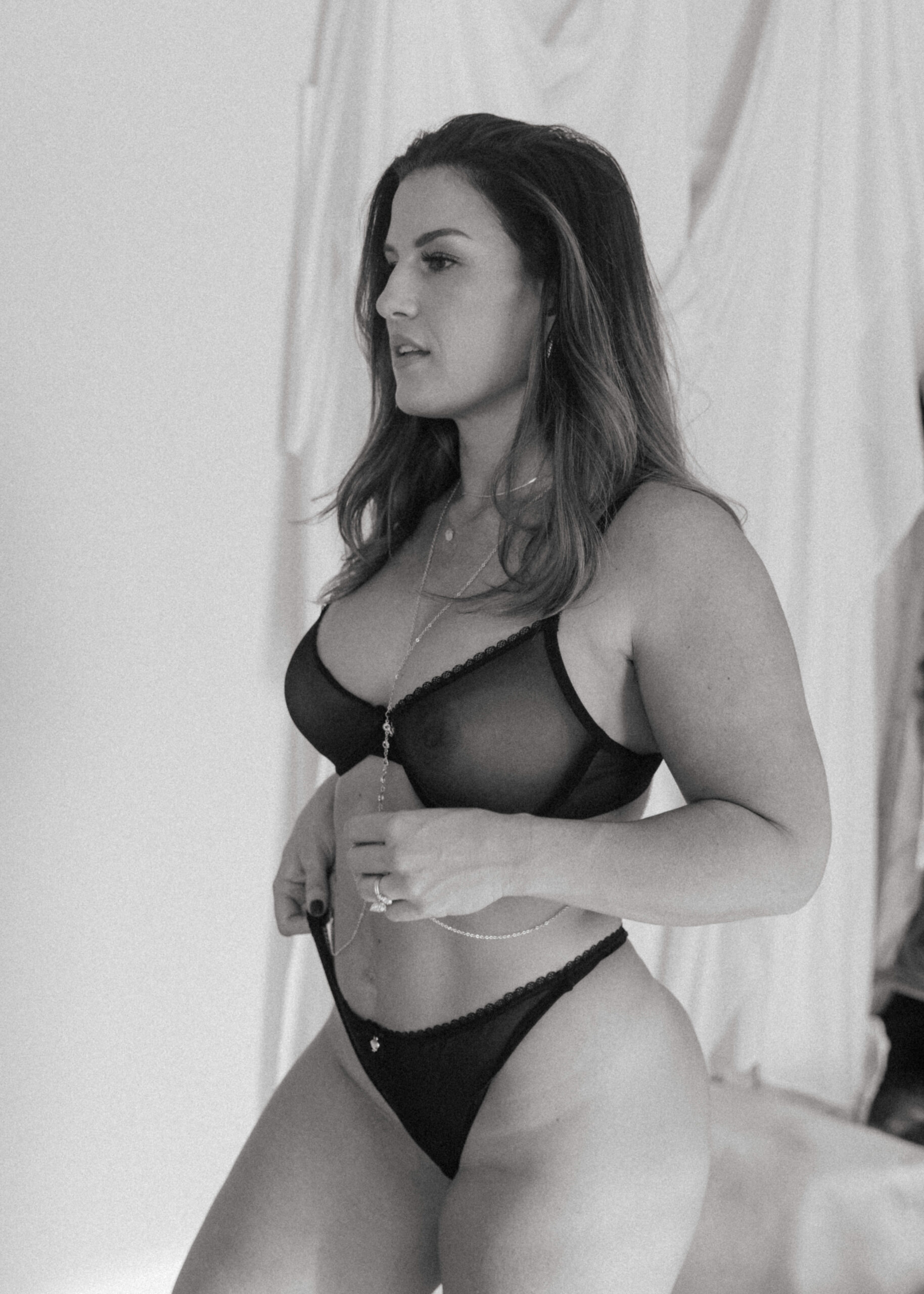 a woman in black intimates during a boudoir shoot 