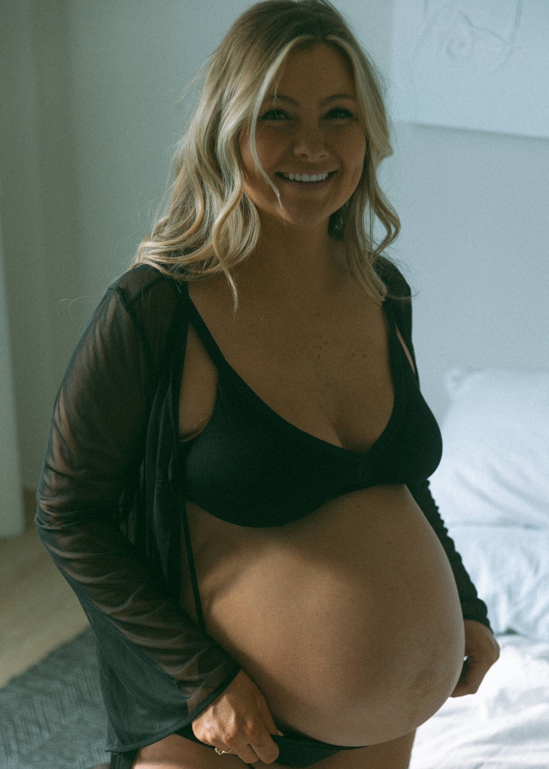 pregnant woman in intimates at her studio maternity photoshoot