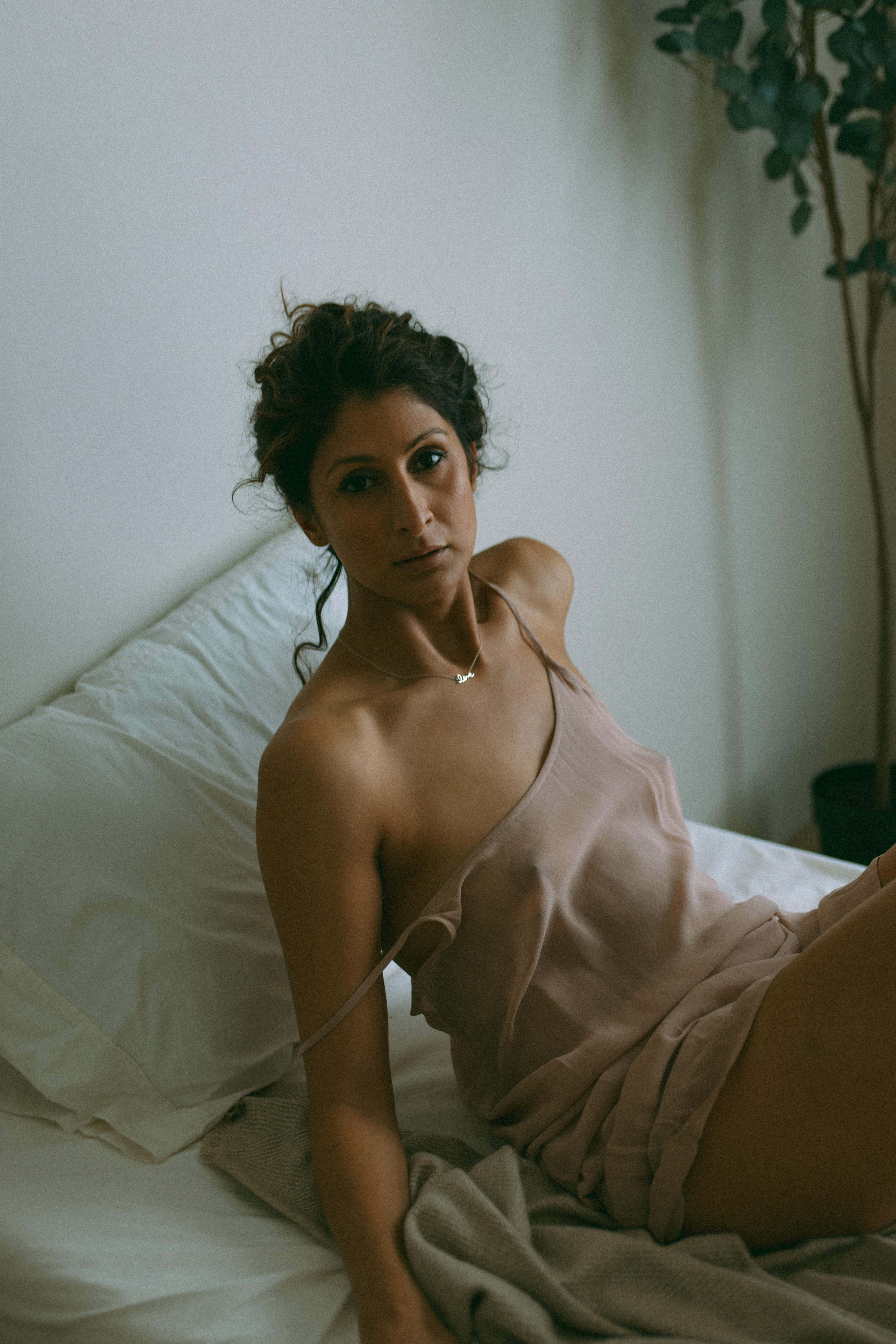 intimate portraiture of a woman in a bed 
