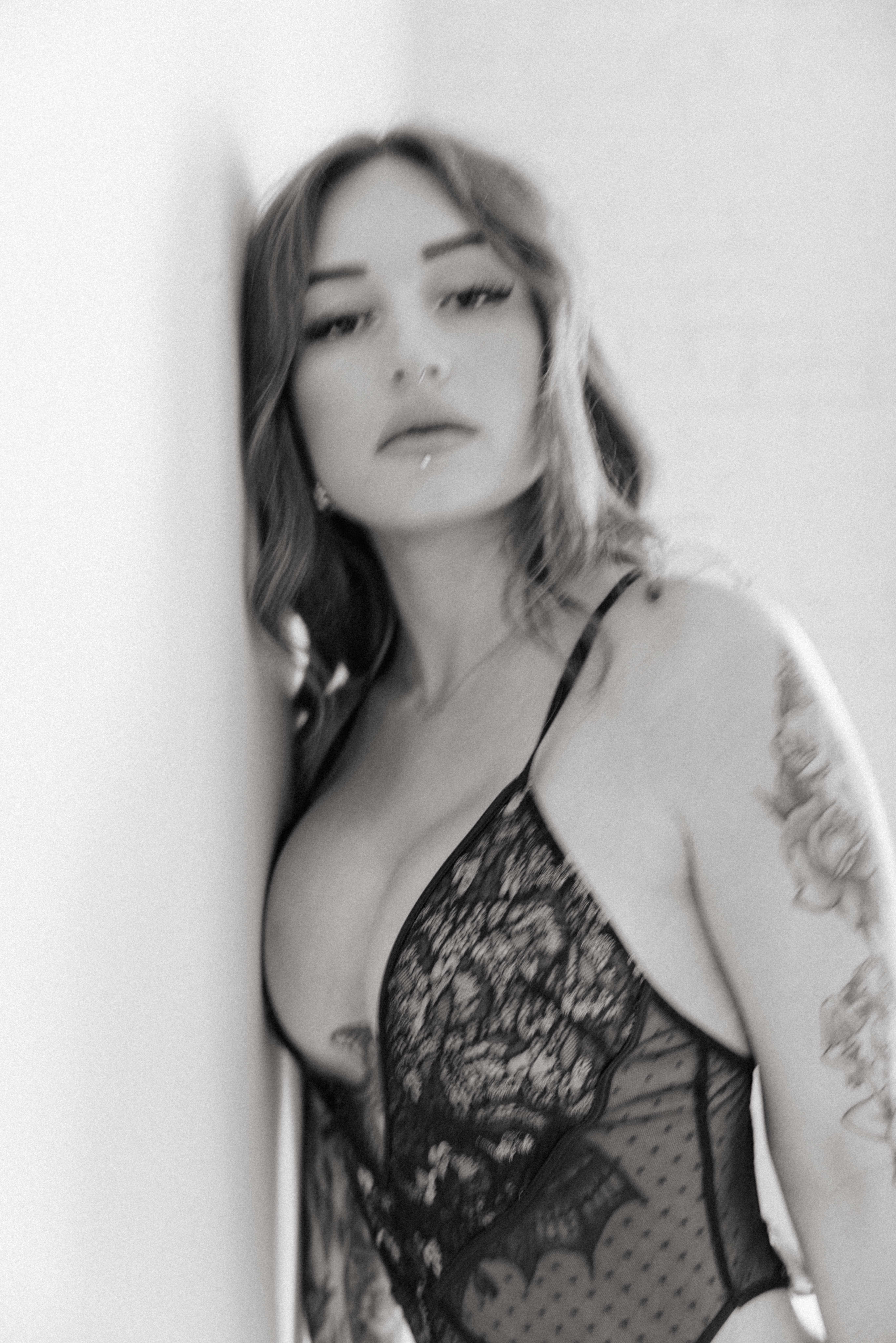 blurry intimate portrait of a woman wearing lingerie 