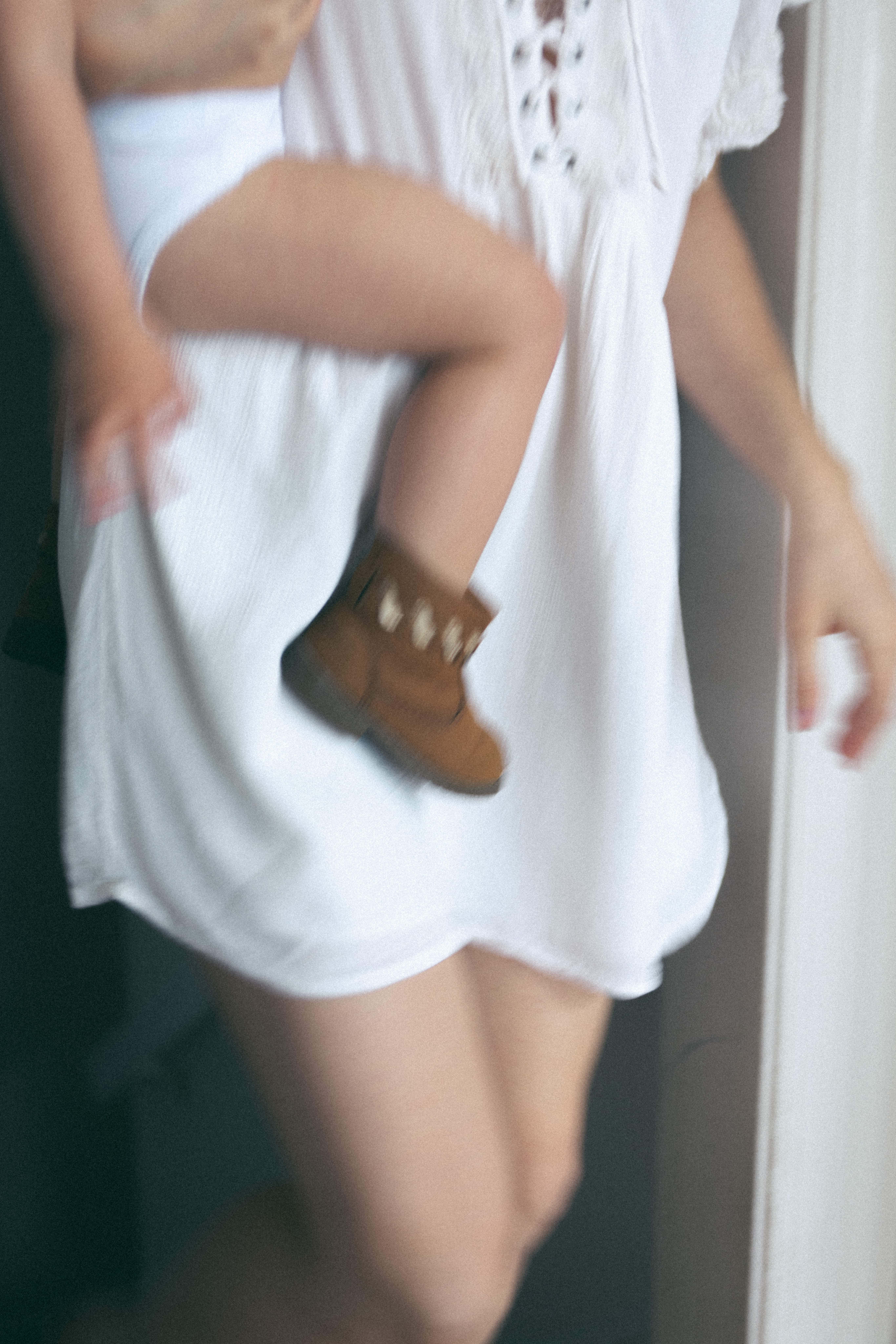 blurry photo of mother carrying baby
