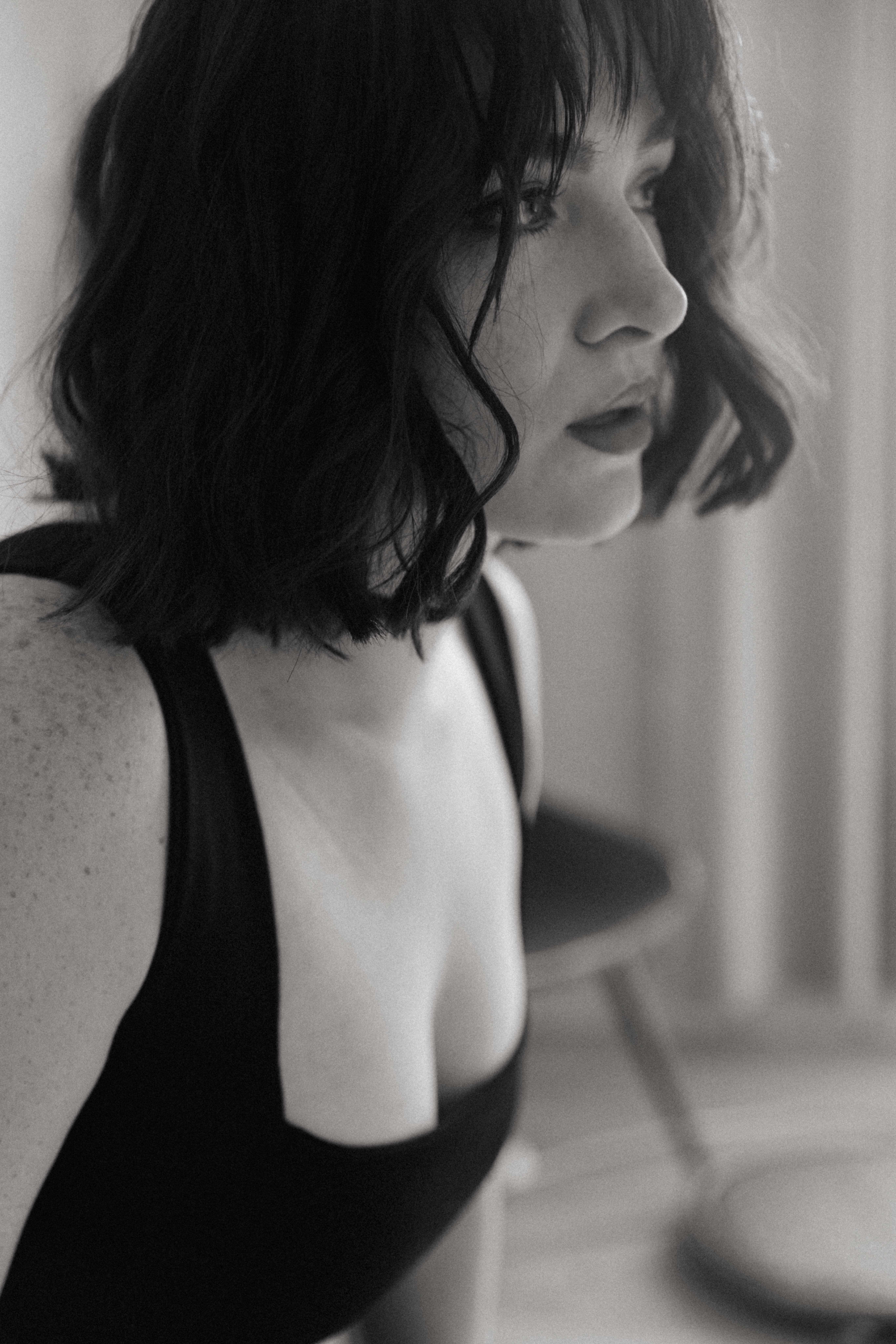 a woman with short black hair showing what is a boudoir photoshoot